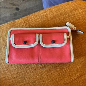Coach peach colour clutch, like new with minor interior wear.